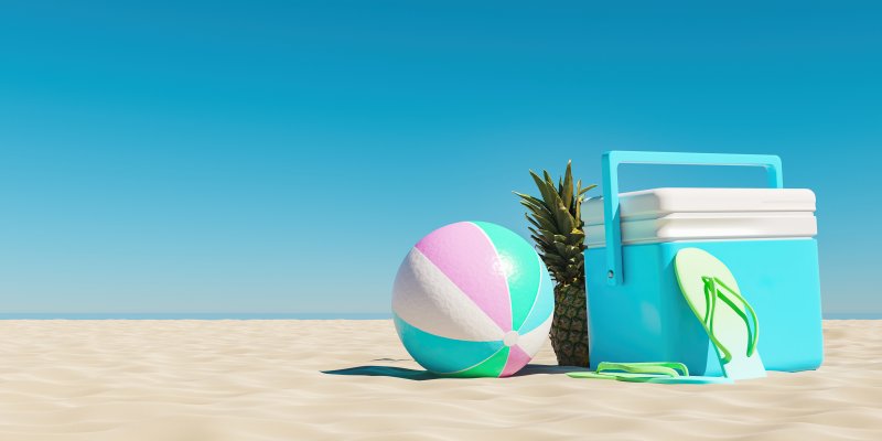 Beach ball, sand, blue sky and esky!